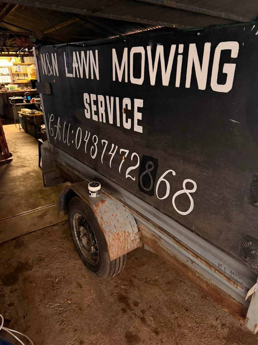 N&N Lawn Mowing Service trailer with signwriting, used for rubbish removal