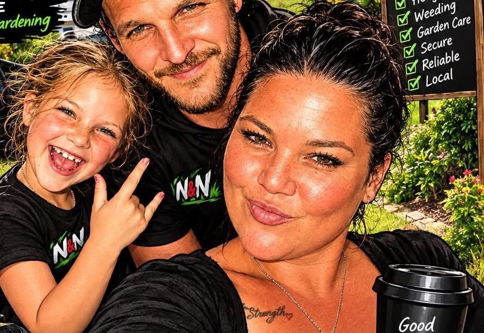 Nathan and Nisha, owners of N&N Lawn Mowing Service, with their daughter